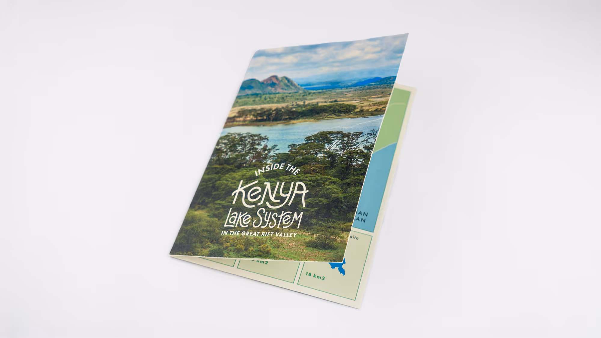 Brochure titled 'Inside the Kenya Lake System in the Great Rift Valley' featuring a landscape with trees, lake, and mountains.