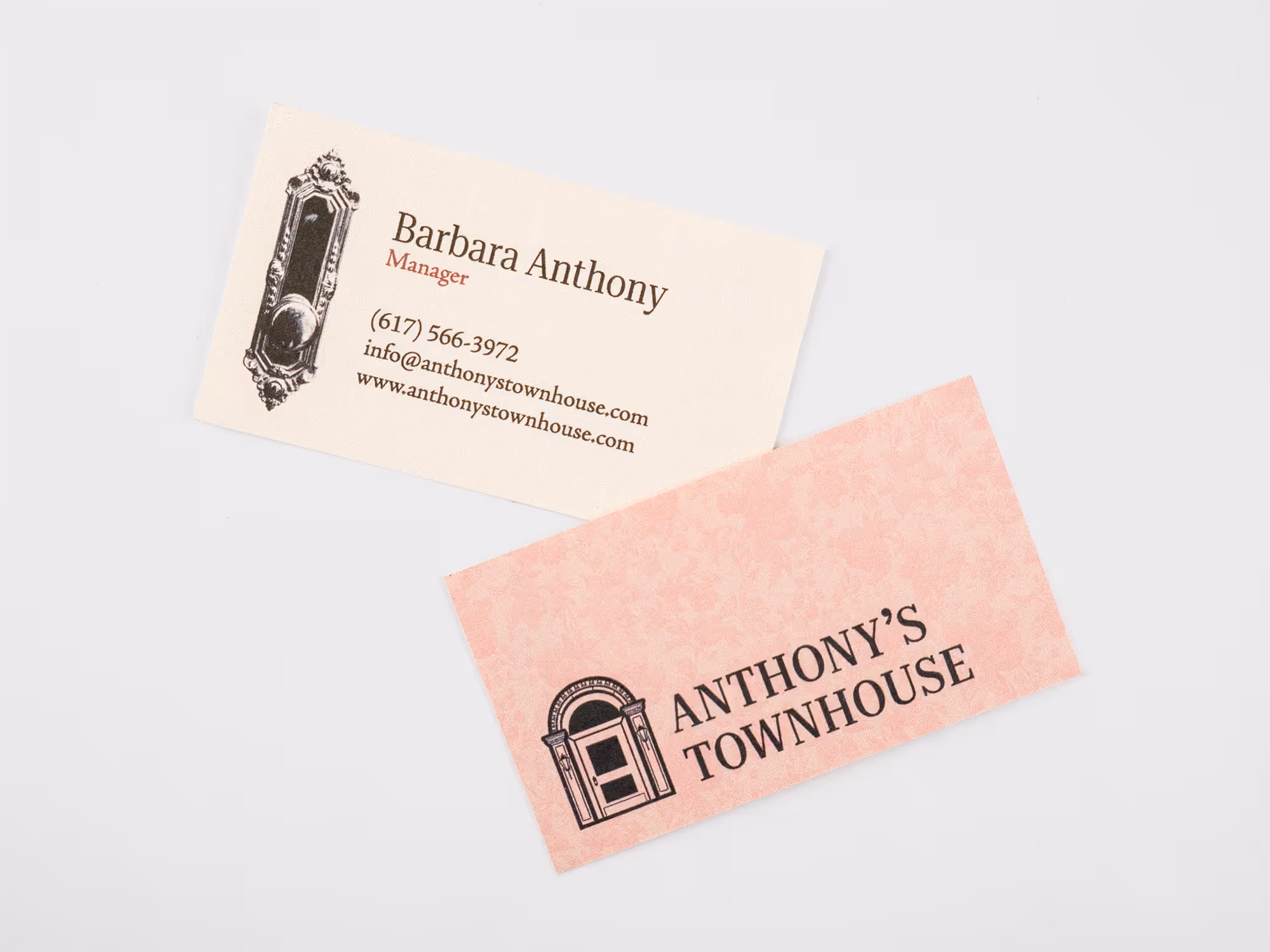 Two sides of a business card on a white surface, one with contact info for Barbara Anthony, Manager, and the other showing Anthony's Townhouse logo and name.
