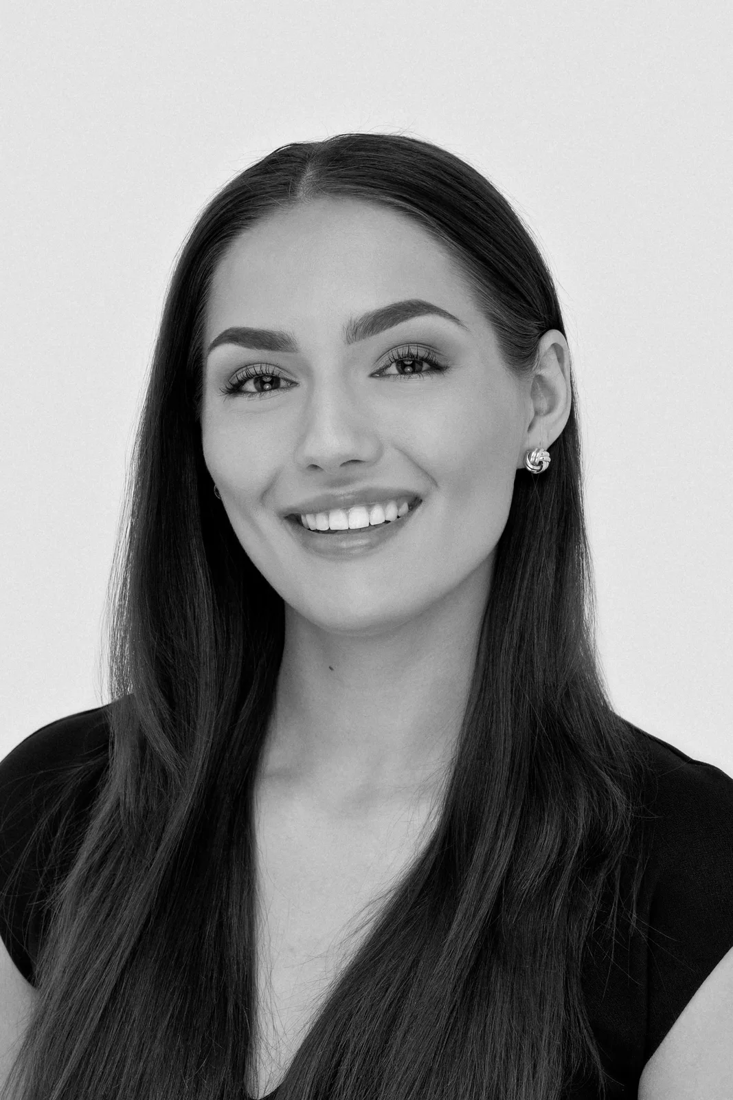 Black and white studio portrait of a business professional