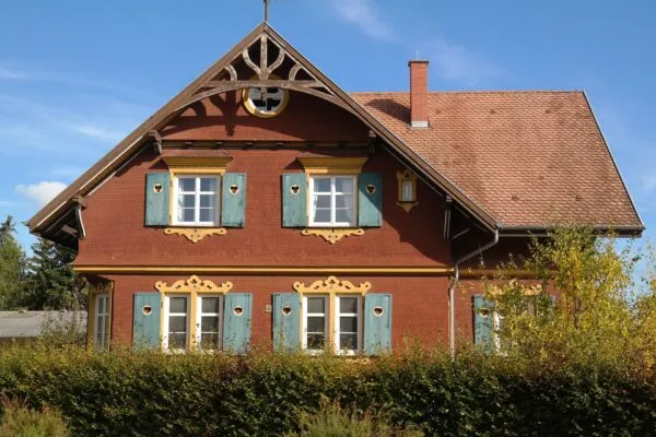 Classic gable roof with blue shutters