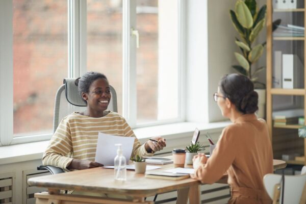sales manager coaching a roofing saleswoman