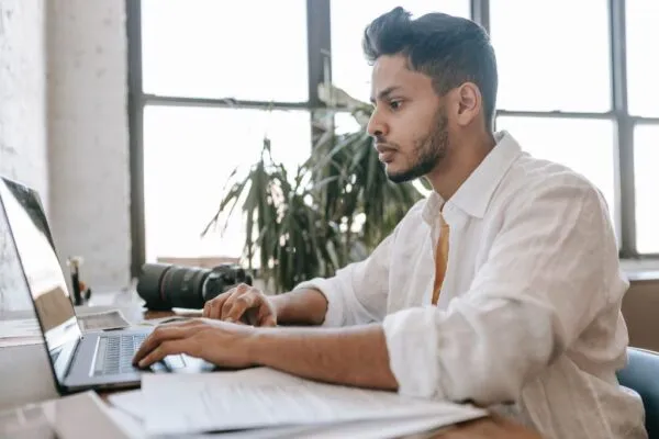 Man creating reports on a laptop