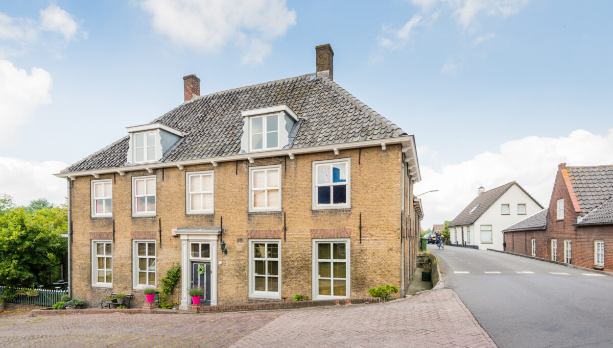 vintage home with a hip roof