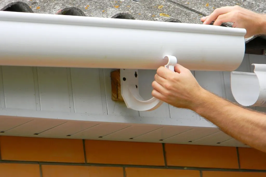Putting gutters into place