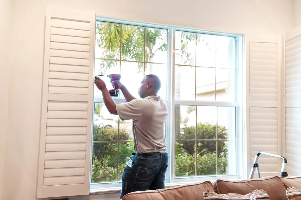 A roofer installing windows for extra income