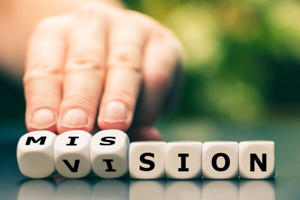 Letter cubes that spell out Mission and Vision