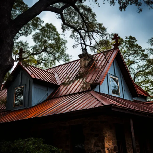 Blue house with a red metal roof