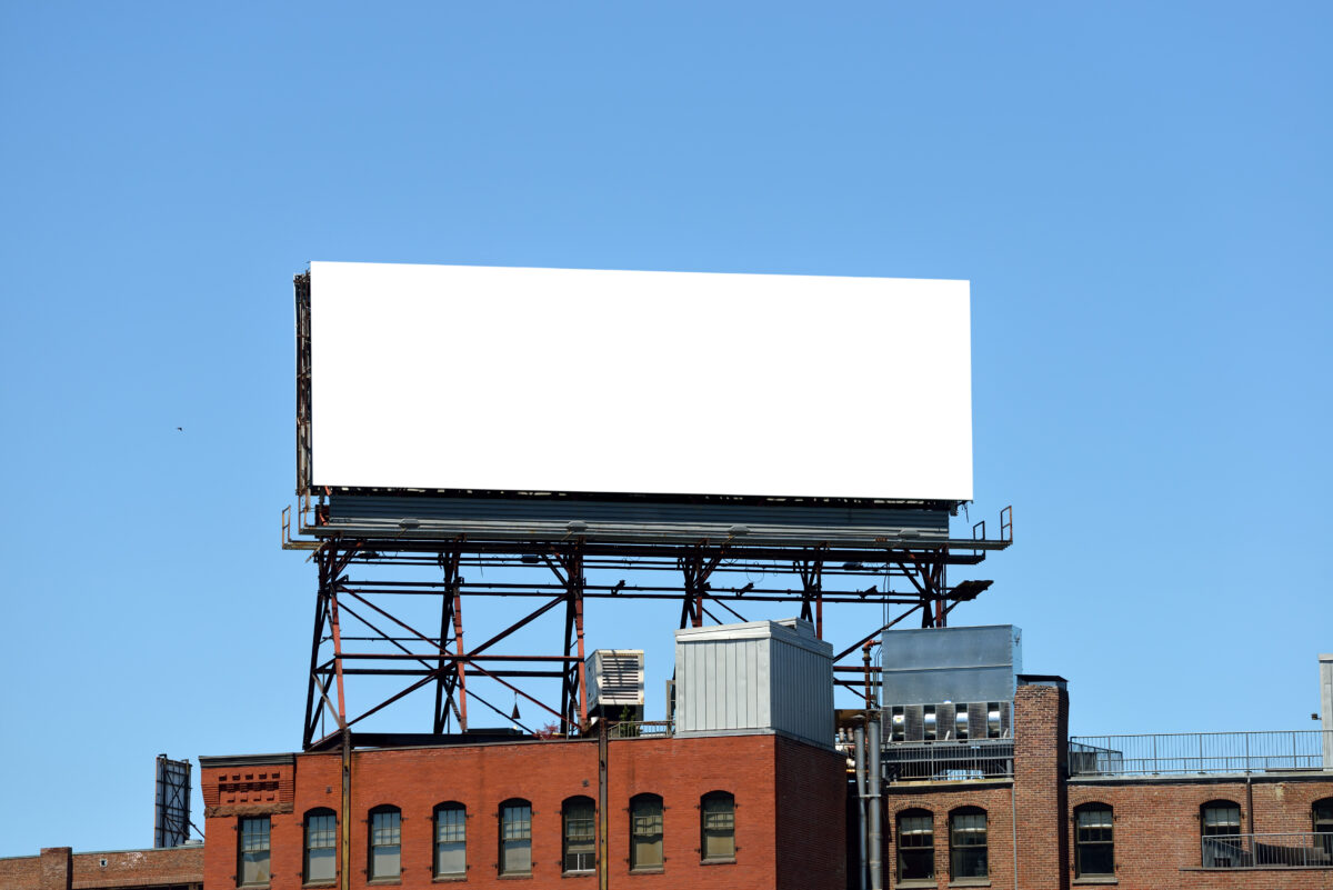Empty white billboard available for solar marketing ads