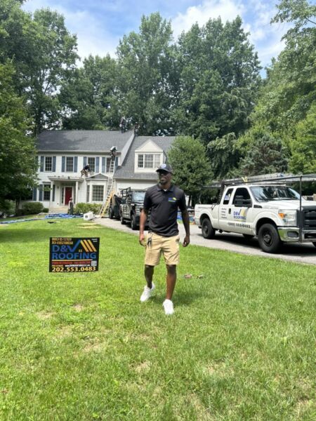 D&V Roofing white truck wrap with blue lettering