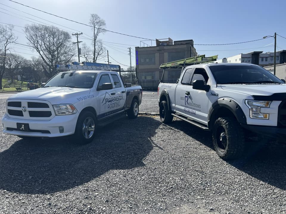 White and blue roofing truck wraps for Paragon Roofing and Roof Solutions