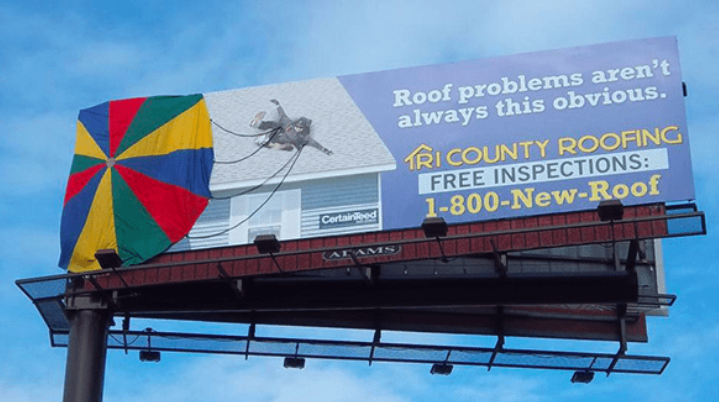 A roofing billboard with a parachute