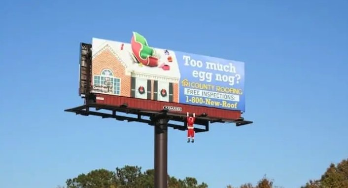 Santa Claus roofing billboard with a dangling mannequin