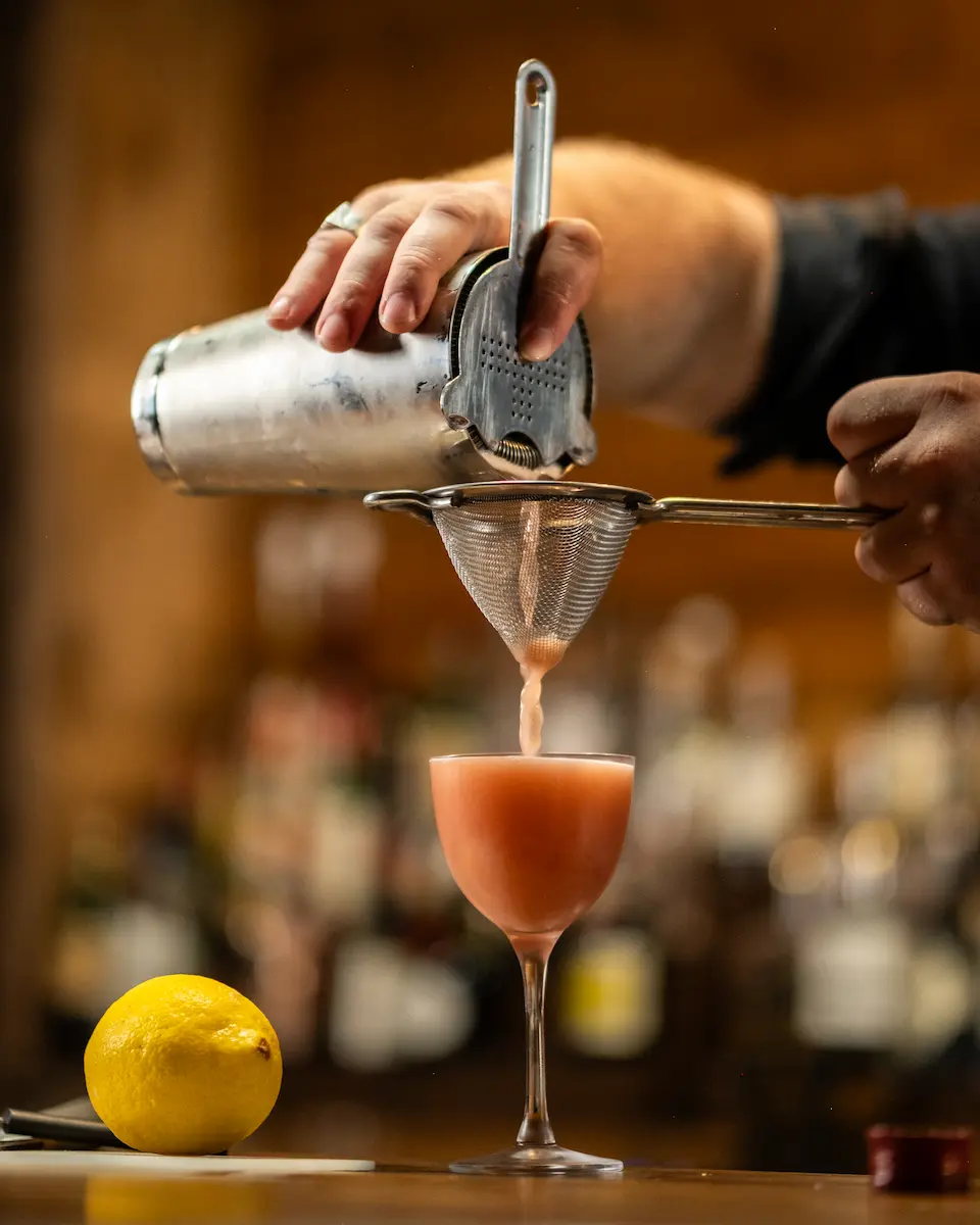 A mixed drink being made