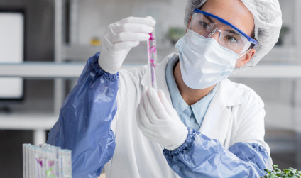 Scientist in safety gear examining a chemical sample in a lab, representing tested and safe pest control methods