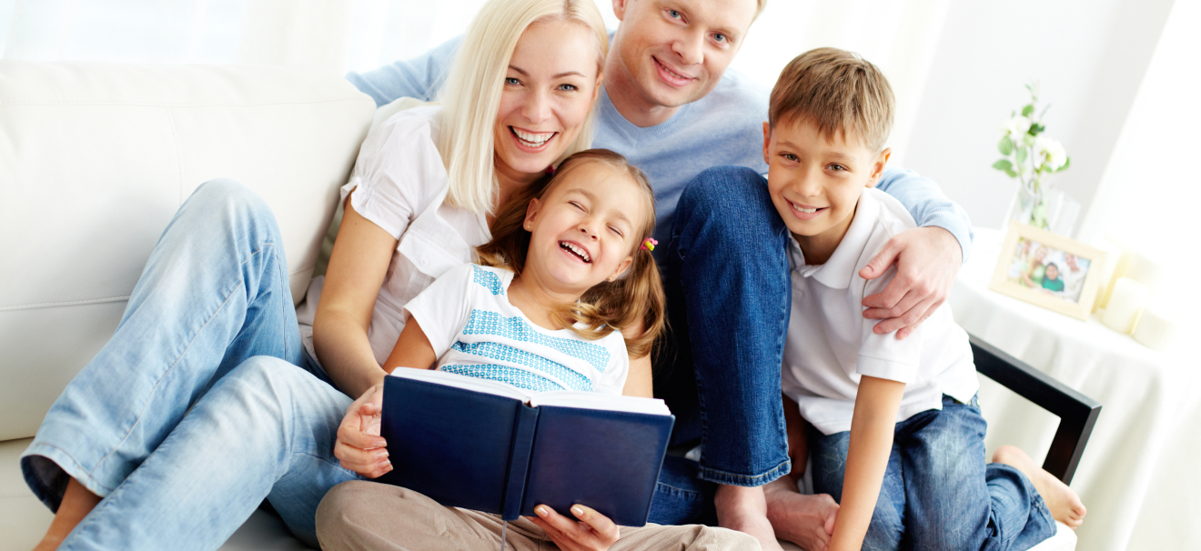Smiling family relaxing in a clean, pest-free living room, representing the results of professional pest control services