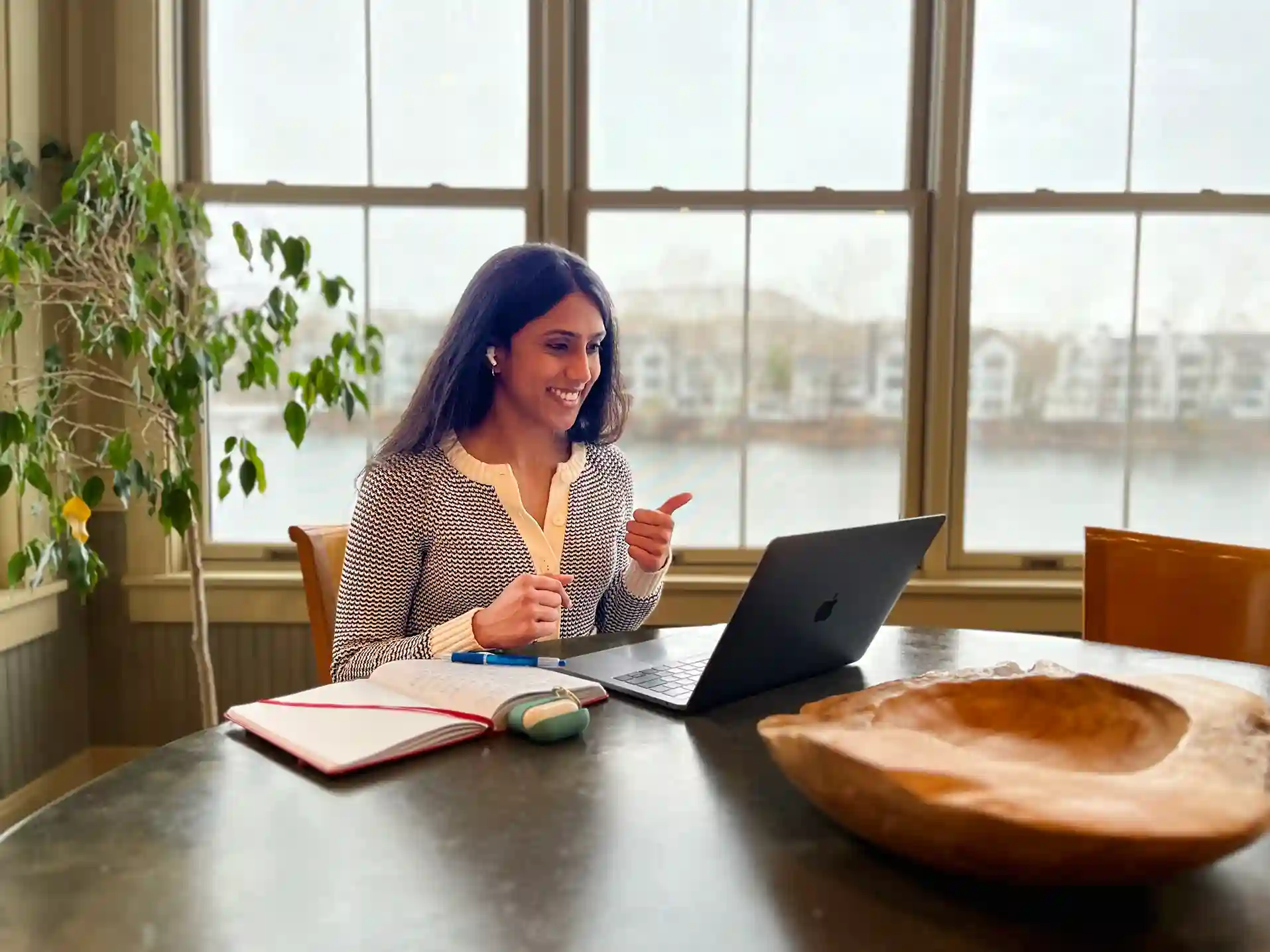 A professional team collaborating in a bright, modern open-plan office environment.