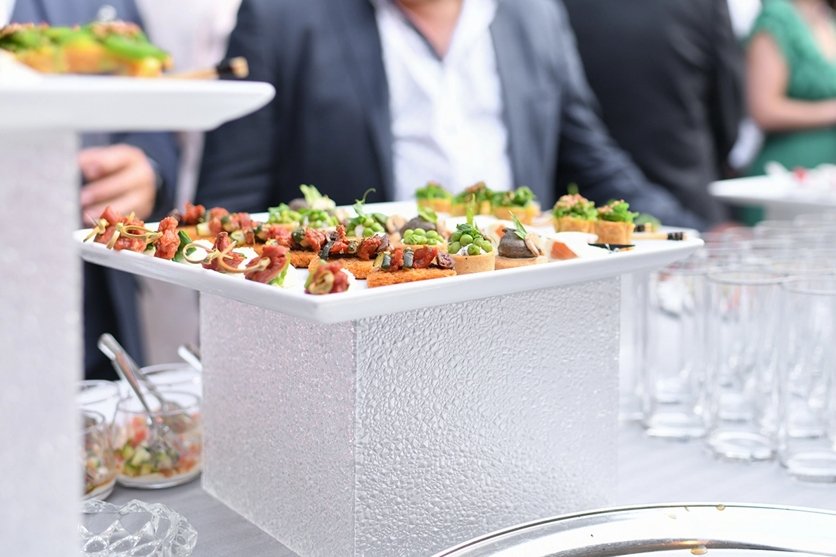 Assorted gourmet appetizers arranged on sleek modern trays, showcasing vibrant colors and textures for an upscale Scottsdale cocktail event.