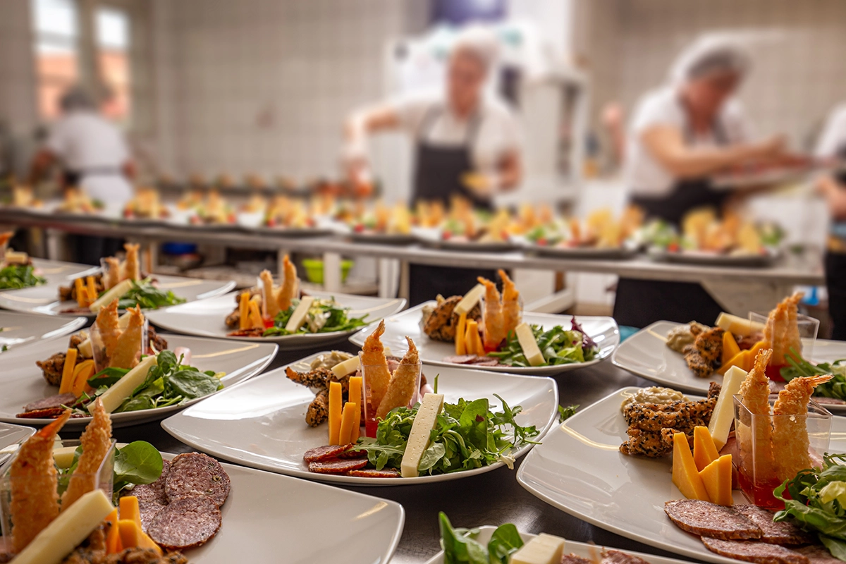High-end corporate catering setup at a luxury workplace event featuring elegant plating and refined presentation.