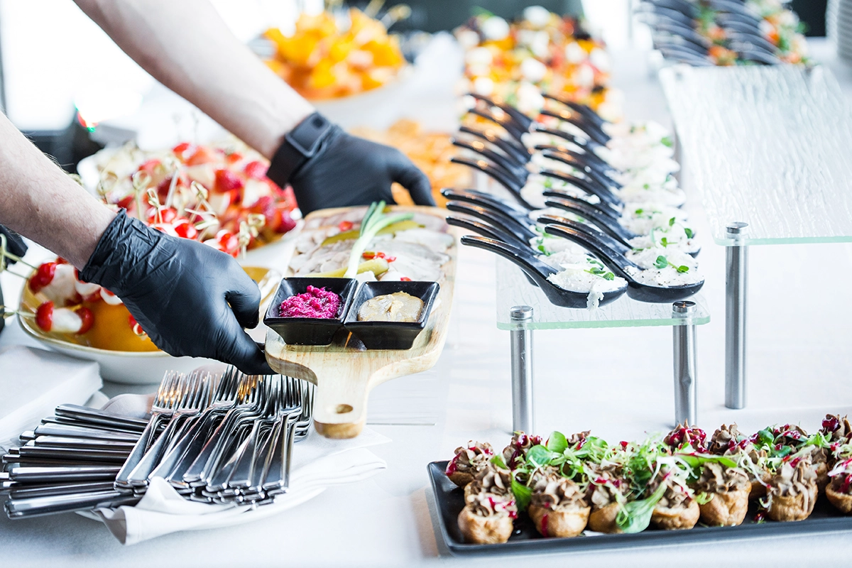 Station-based birthday catering layout designed for guest interaction and flow