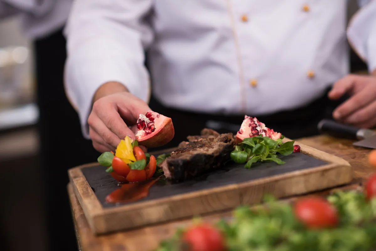 Private chef preparing abeef-steak multi-course dinner in a Scottsdale home for an intimate gathering