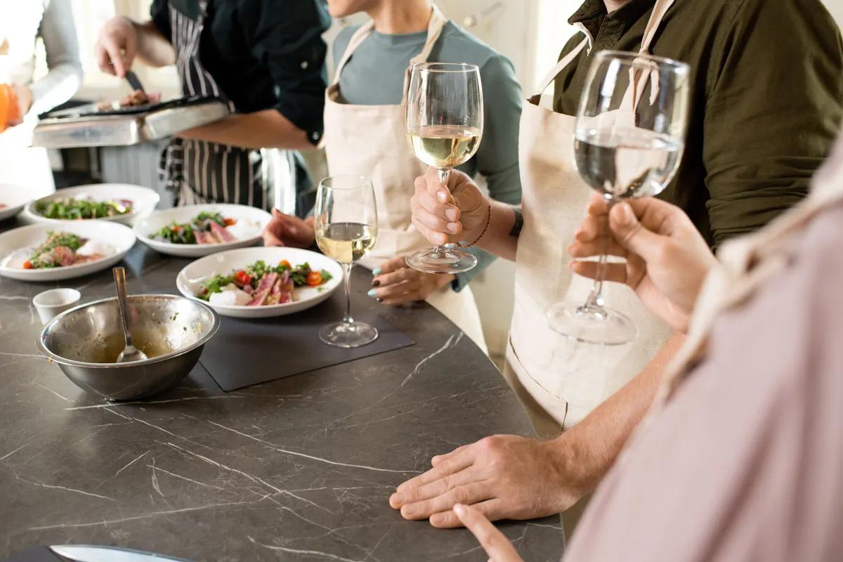 Friends enjoying relaxed conversation during a chef-prepared dinner at home in Scottsdale