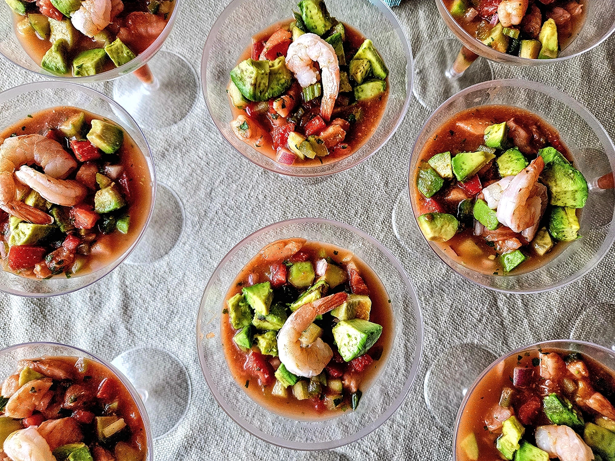 Fresh shrimp ceviche served in chilled martini glasses with avocado and tomato, ideal for Scottsdale early summer outdoor catering and seasonal dining events