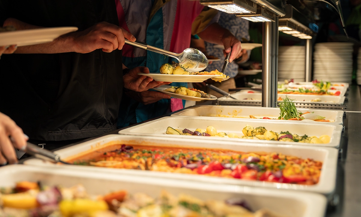 A buffet line of a thanksgiving menu of traditional sides