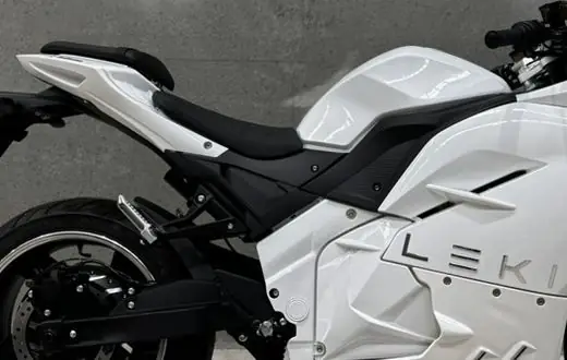 The seat and tank of a white Leki motorbike