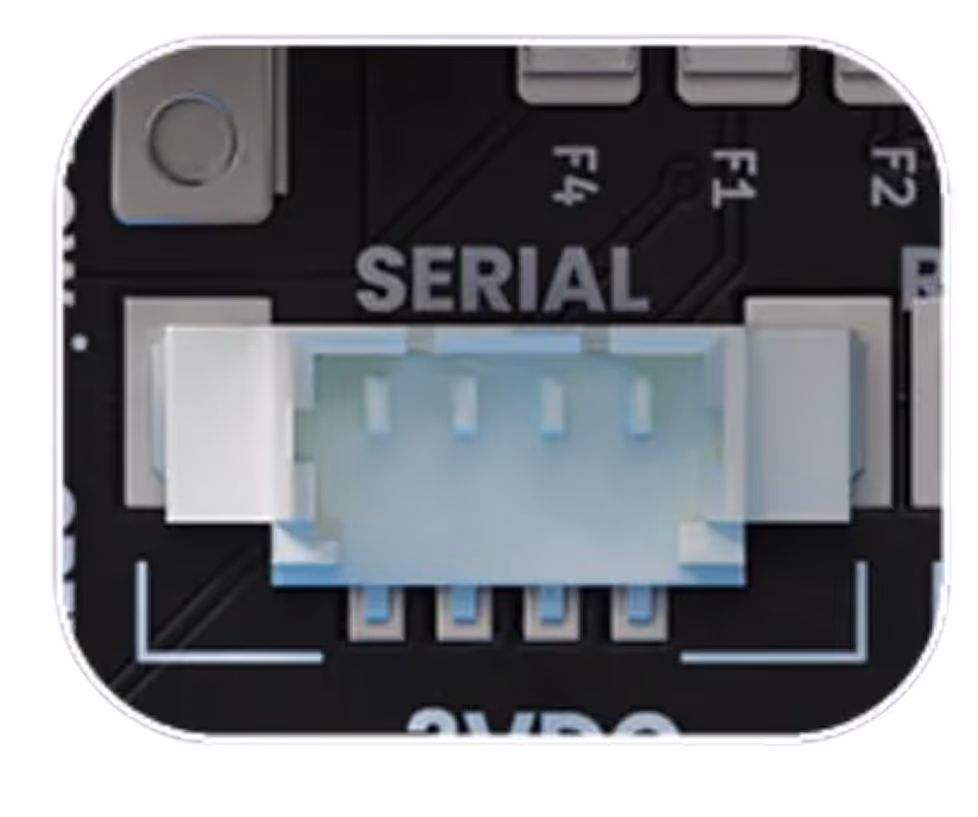 Close-up of a white 4-pin connector labeled SERIAL on a black circuit board.