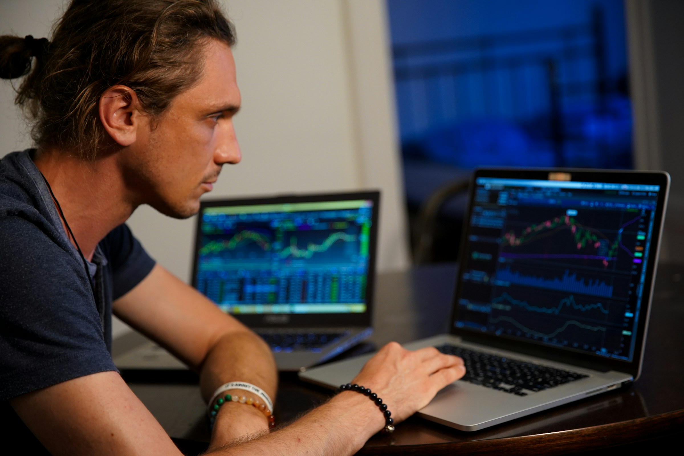 man trading on a laptop - What Is Prop Trading