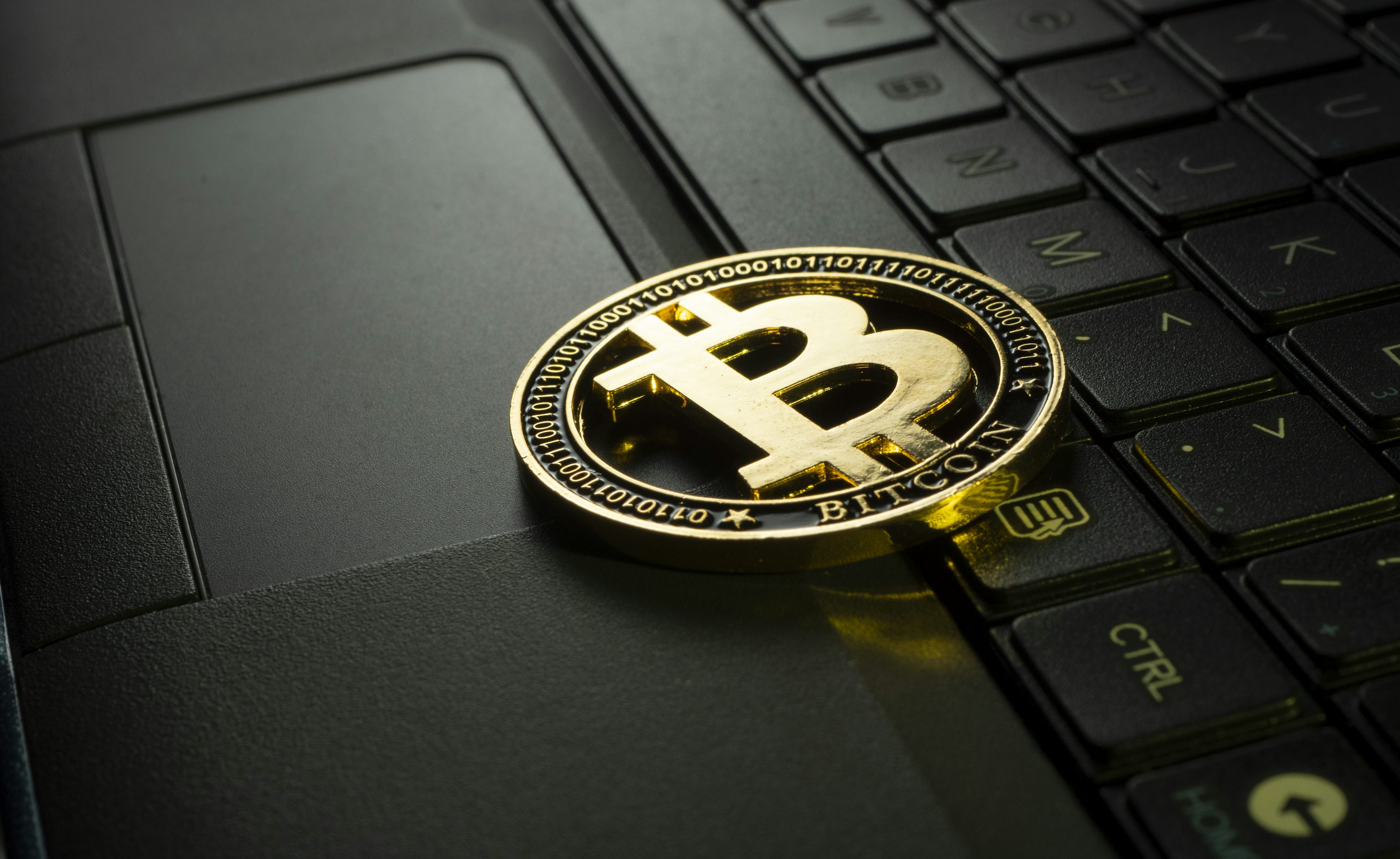 silver and black round emblem - Best Cryptos for Day Trading
