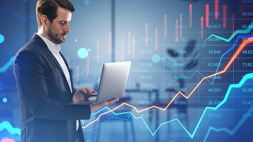 man holding a laptop - Day Trader Salary
