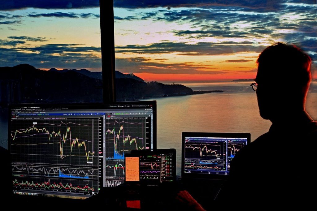 man trading near a window - Day Trader Salary