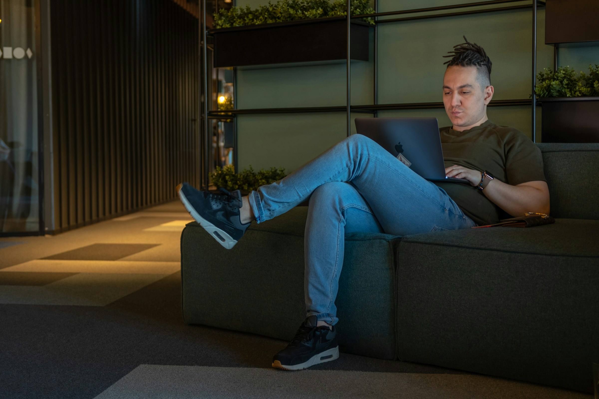 man sitting on a sofa - Automated Forex Trading