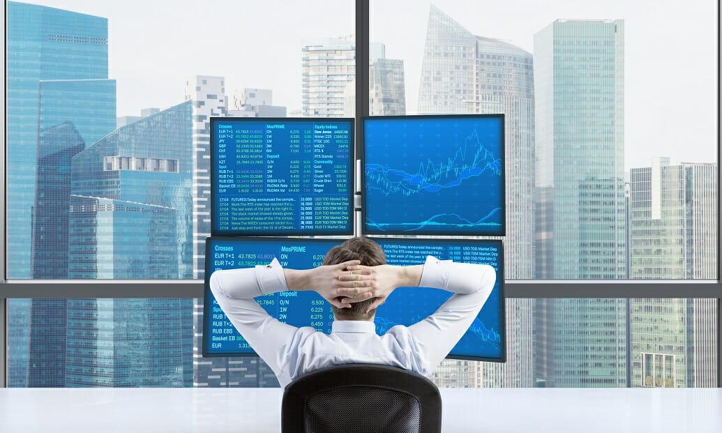 man trading near a window - Best Timeframe For Swing Trading