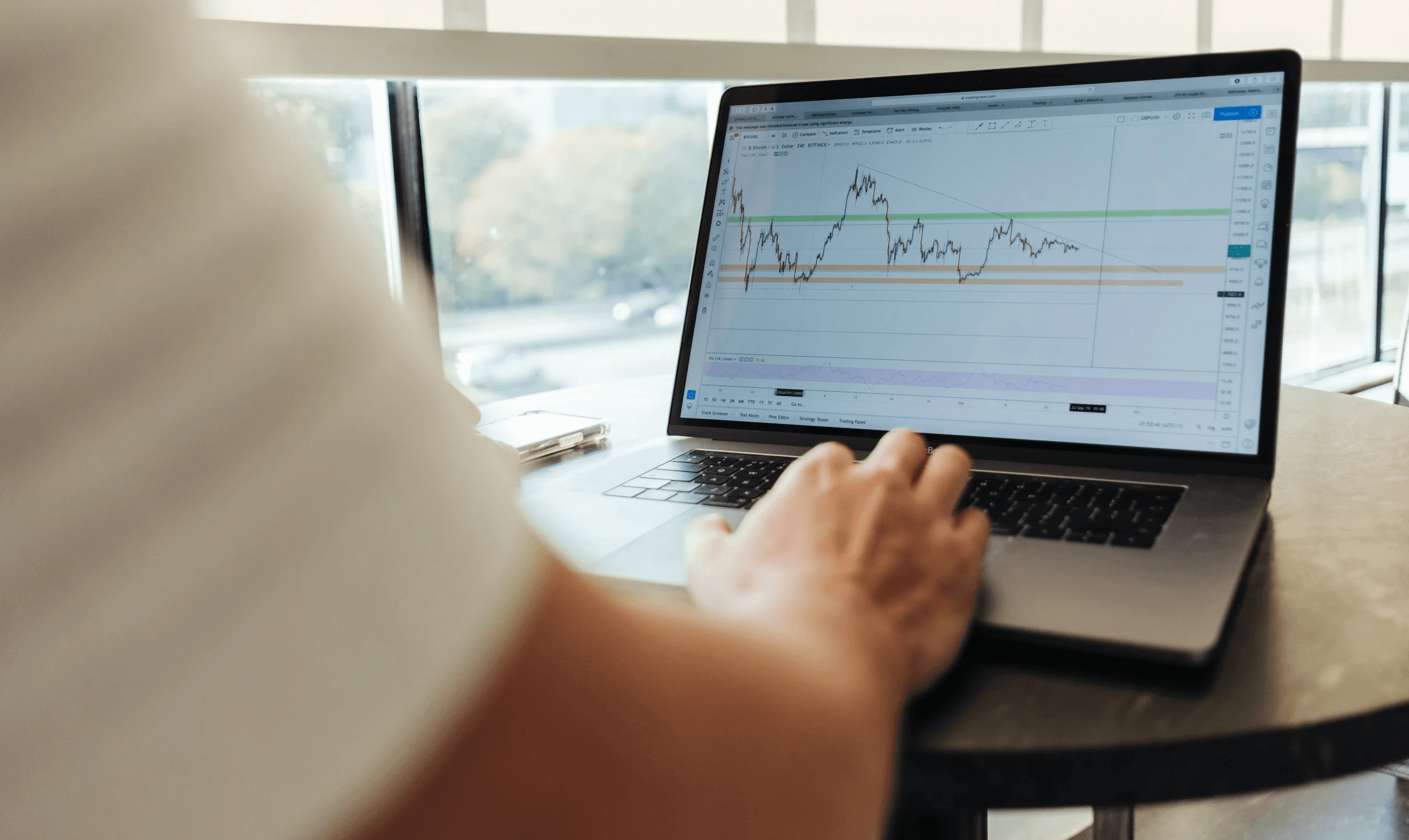  Person analyzing stock market chart - What Is Leverage In Trading