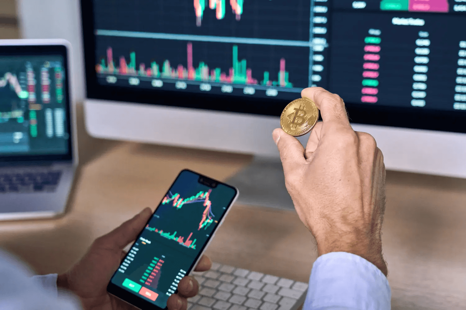 Man holding Bitcoin coin while trading crypto - What Is Leverage In Crypto Trading