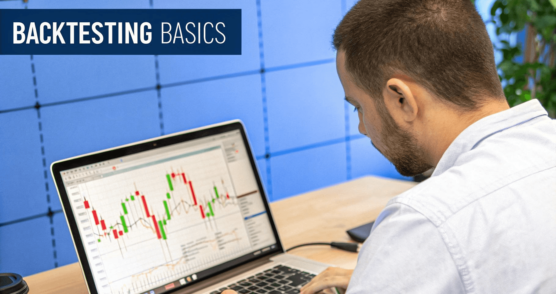 Man analyzing backtesting basics on laptop - Backtesting Trading Strategies
