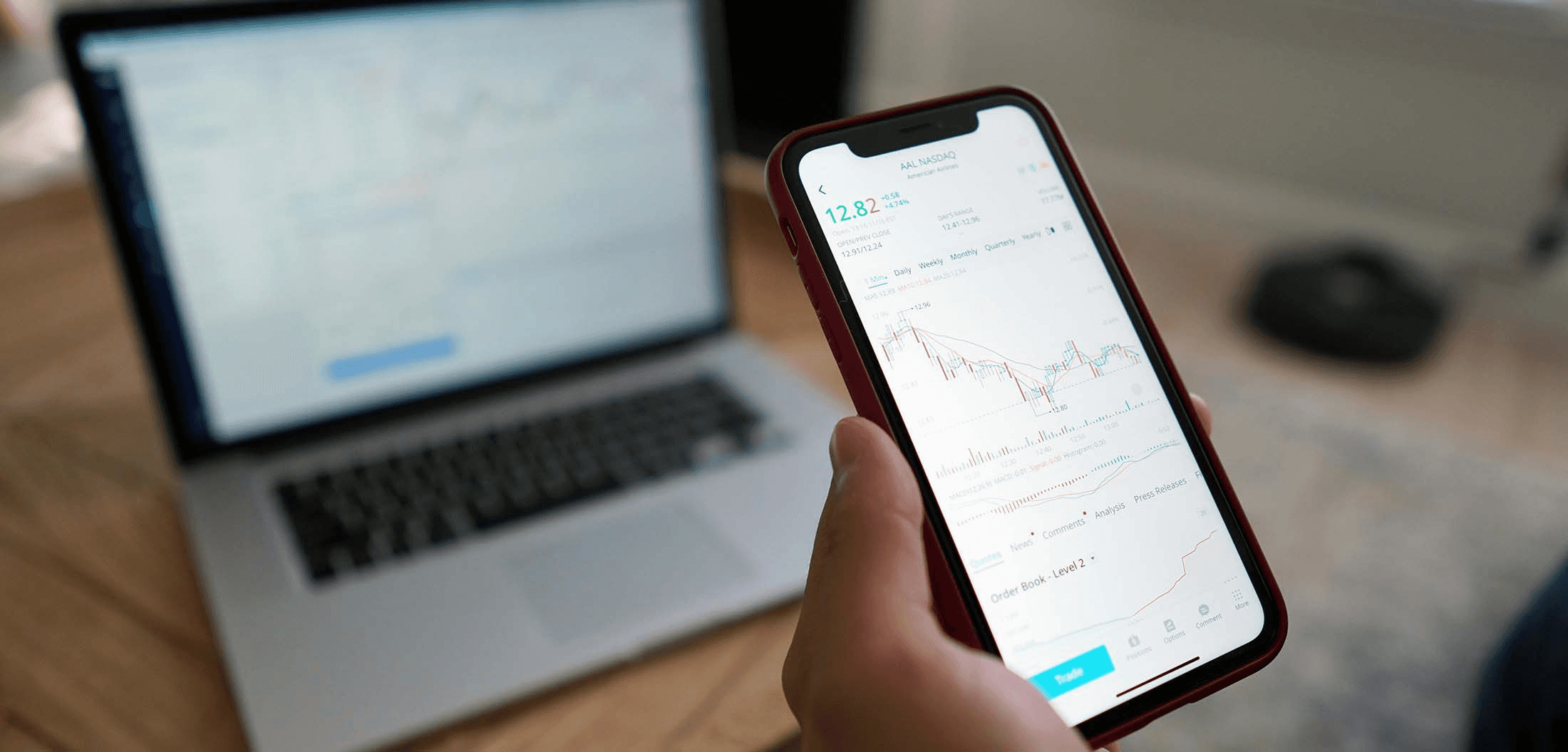 Person checking stock market on phone - Stop Loss Day Trading