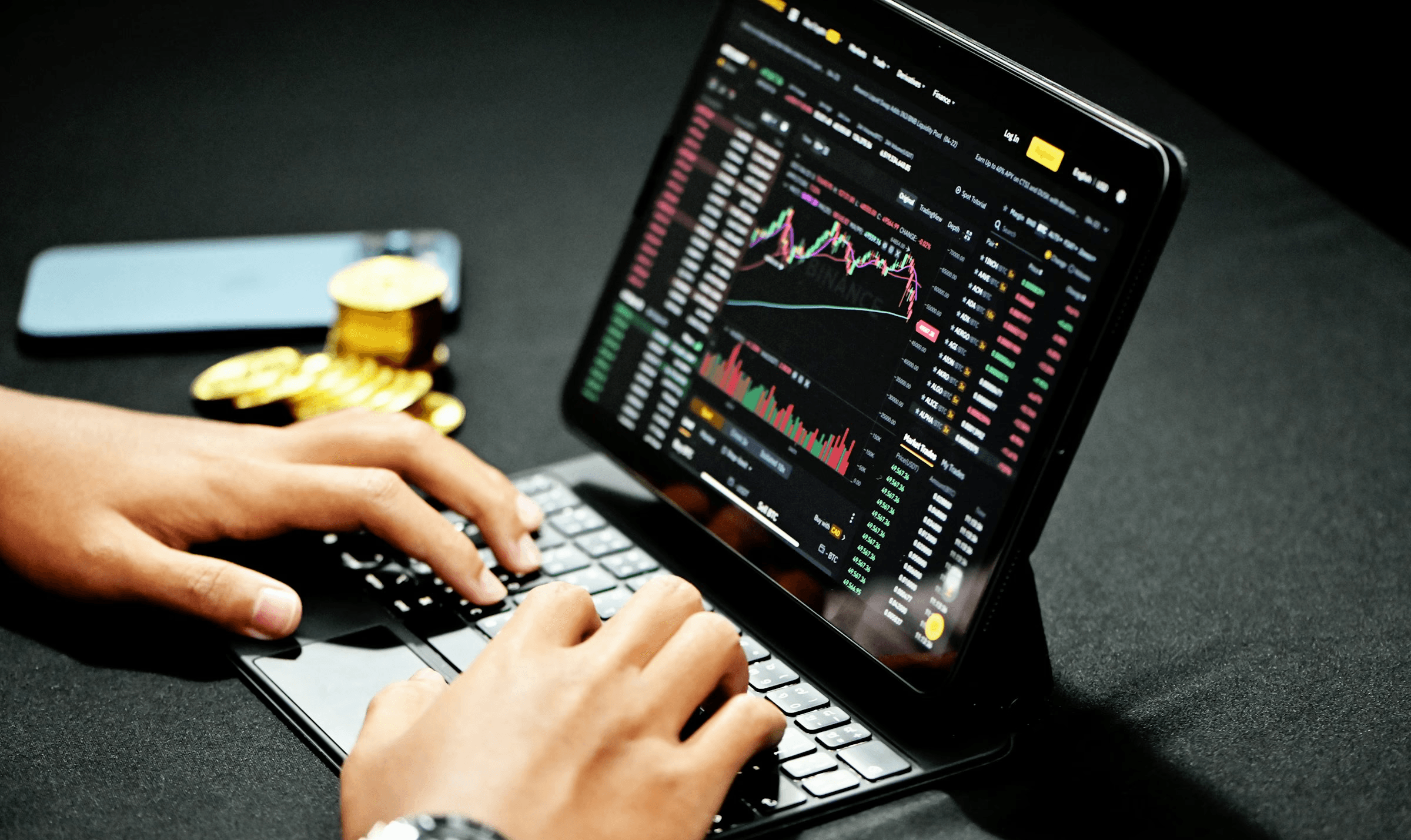  Person trading cryptocurrency on a tablet - Best Stock Trading Simulator