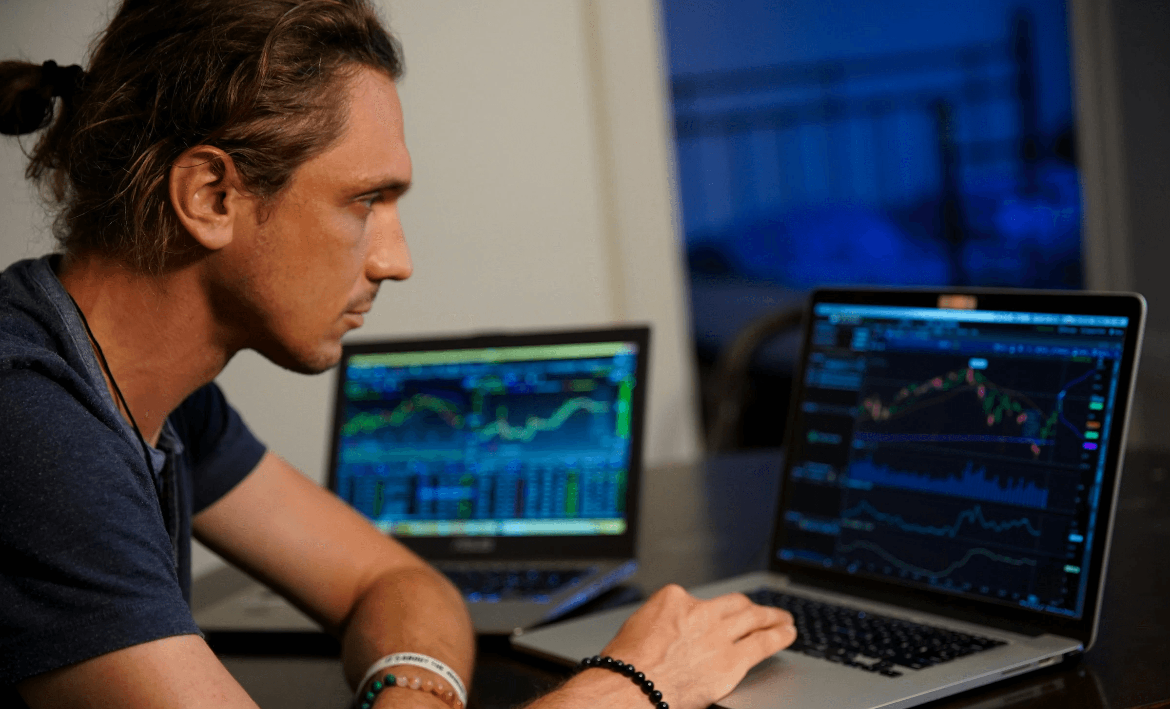 Man monitoring live stock market trading charts -  Best App For Day Trading