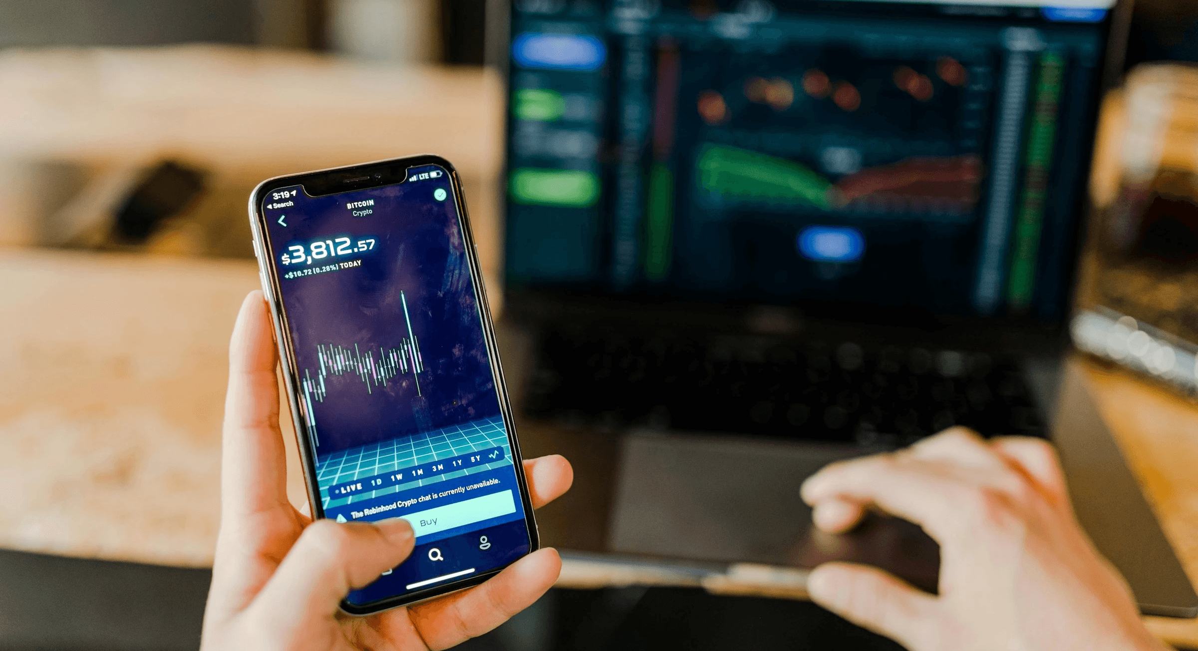 Crypto price data on smartphone screen - Best Crypto Trading Simulator