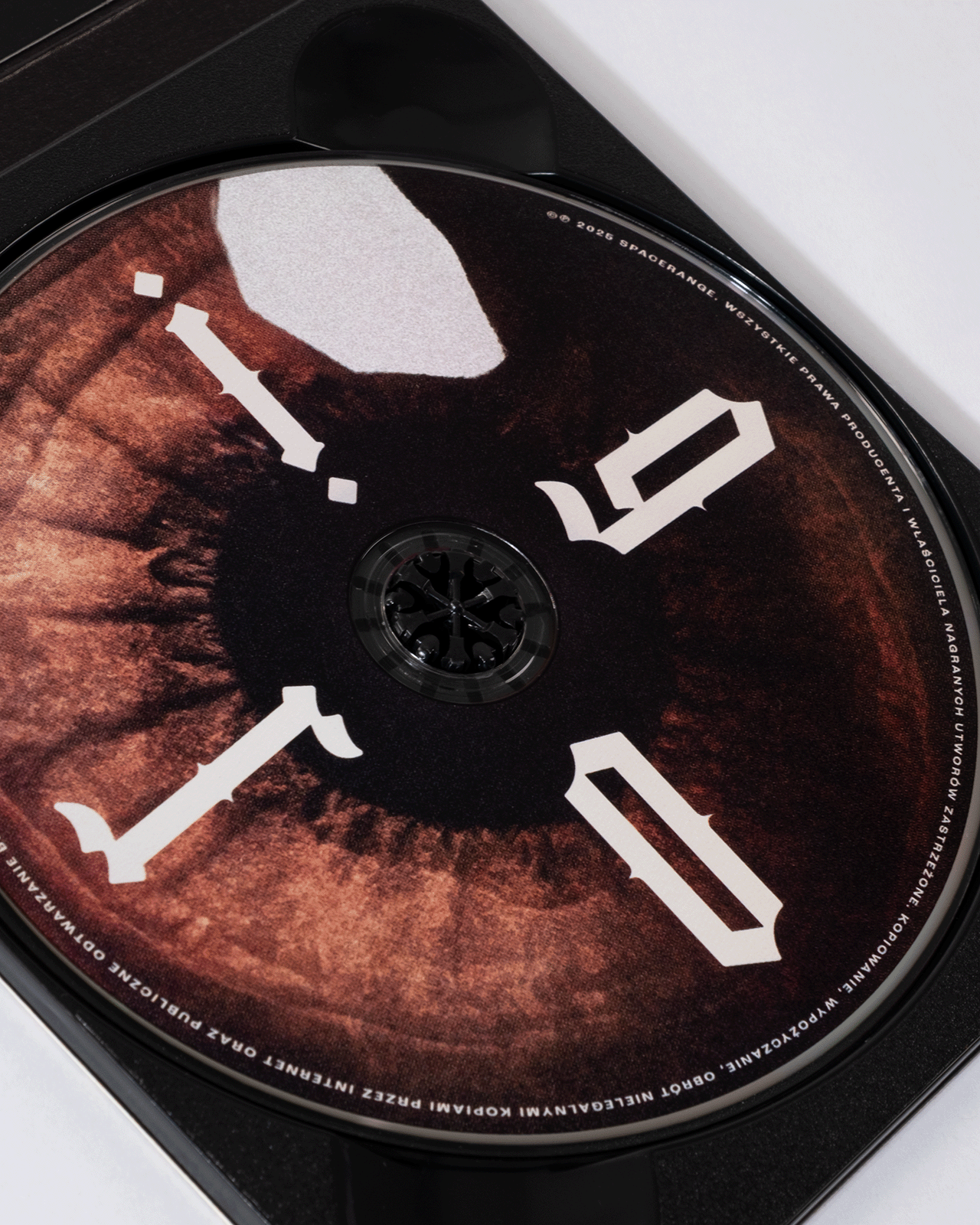 photo of a detail of cd with an eye design on it