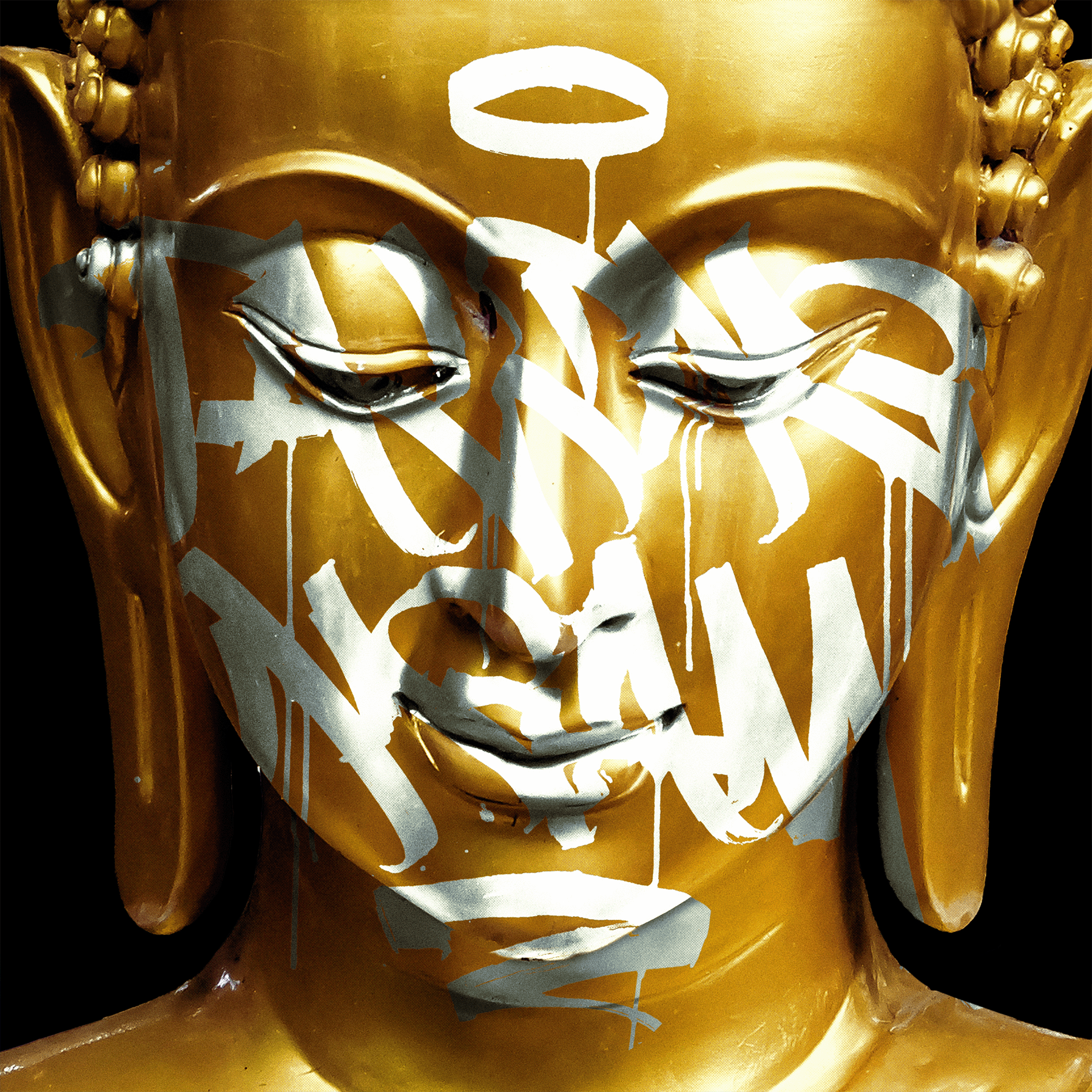 gold budda face with white graffiti 