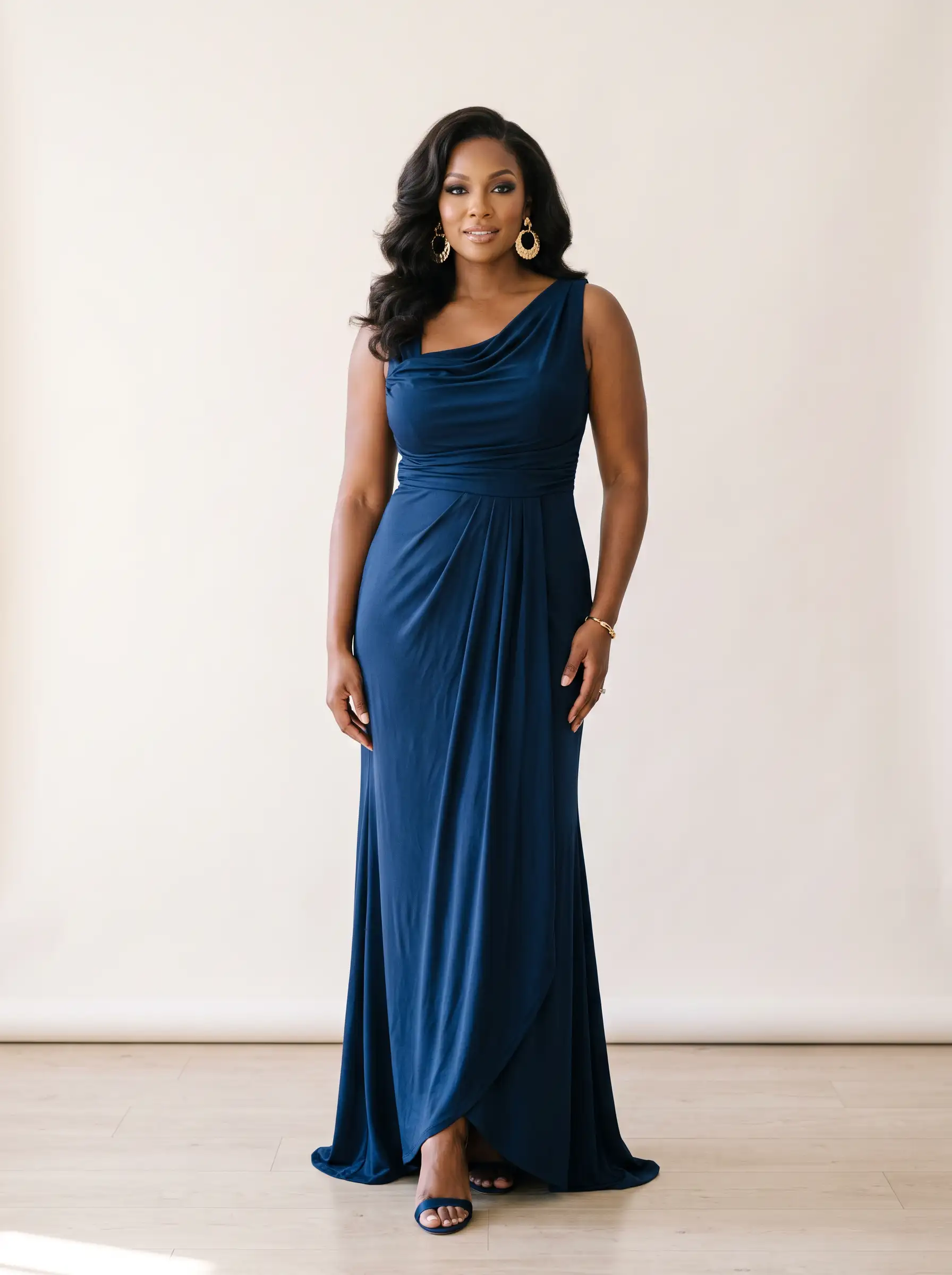 Tall curvy woman in a draped gown illustrating the Soft Dramatic Kibbe body type