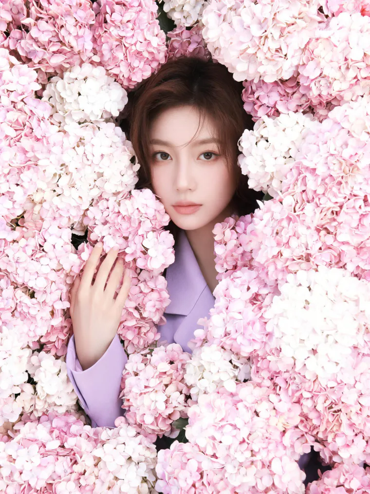 Face in a wall of hydrangeas