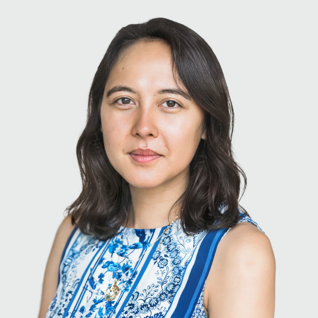 Photo of Catherine Yong, Chief of Staff at Genomics Ltd, in a floral top, looking directly at the camera.