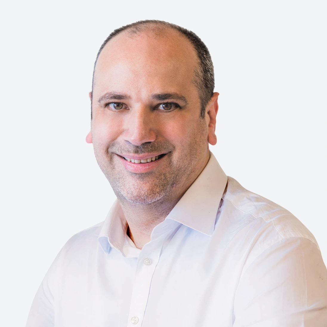 Photo of Alex Ide, GM of SaaS at Genomics Ltd, in a floral top, looking directly at the camera.