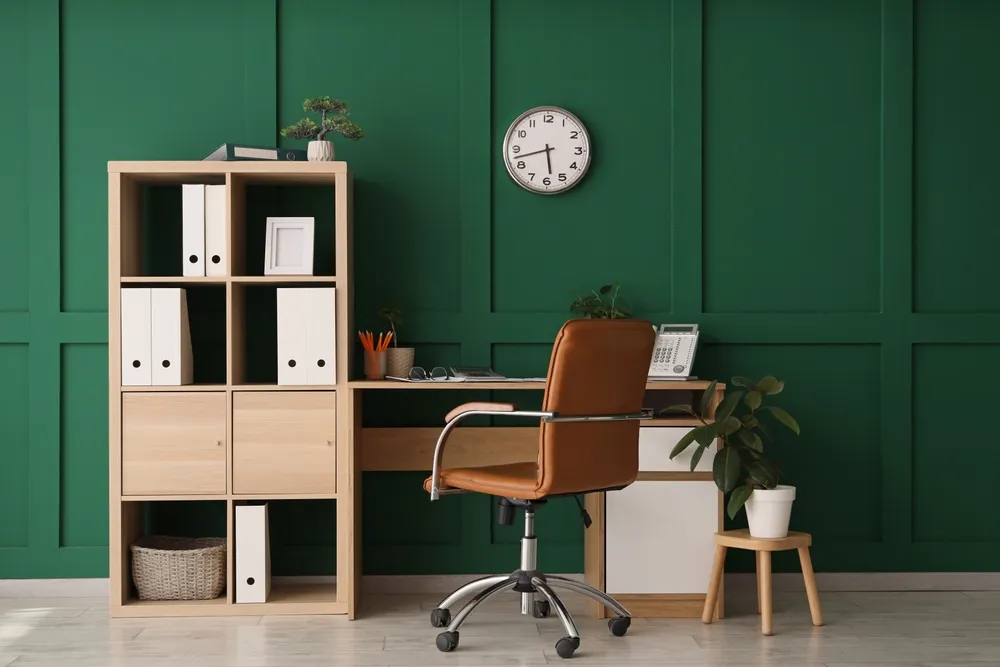 Basement remodel in Kent, WA, showing a custom built-in desk and shelving used as a home office