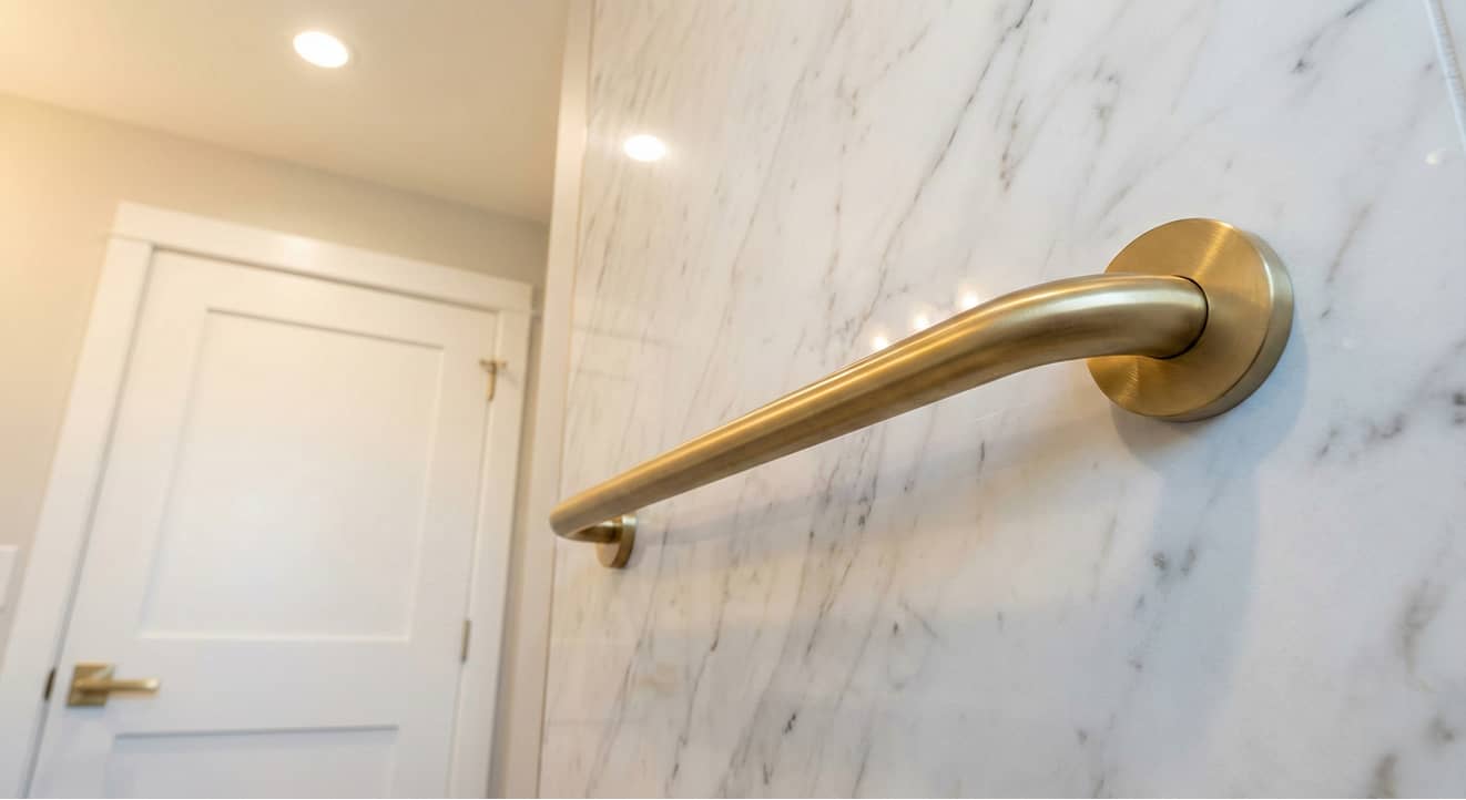 Elderly man using a walker walking down a hallway in a bright home with a living room on the left and a bedroom on the right.